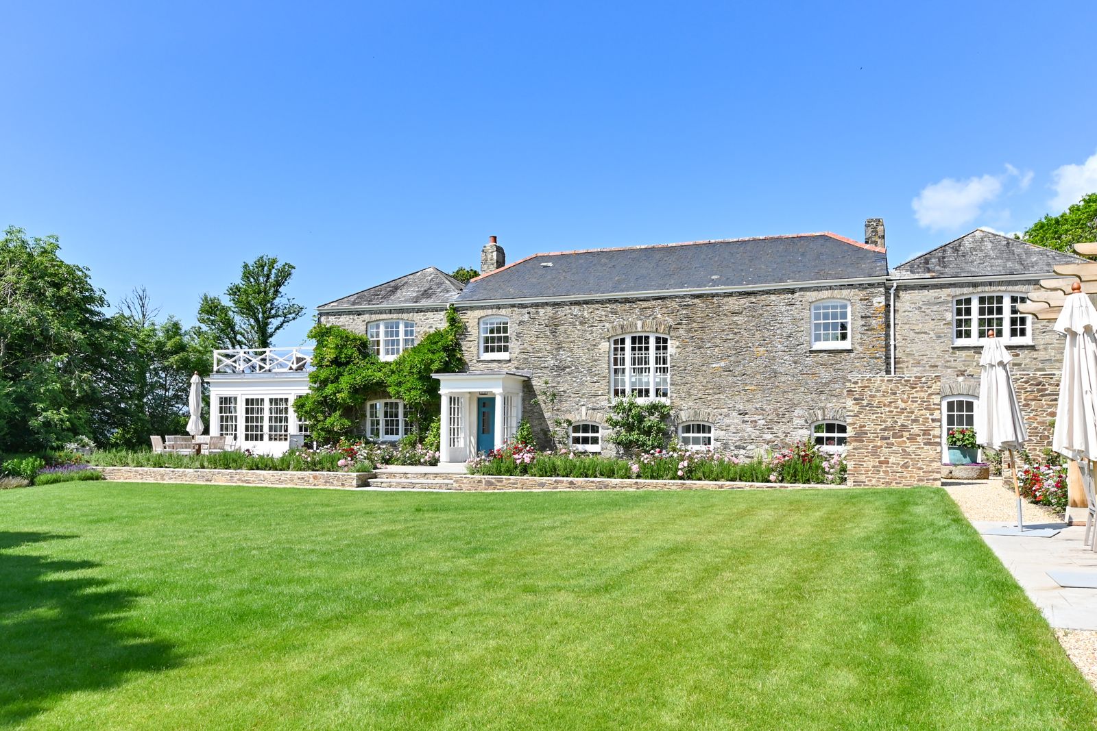 Ince Barton, a stone farmhouse, across a wide lawn