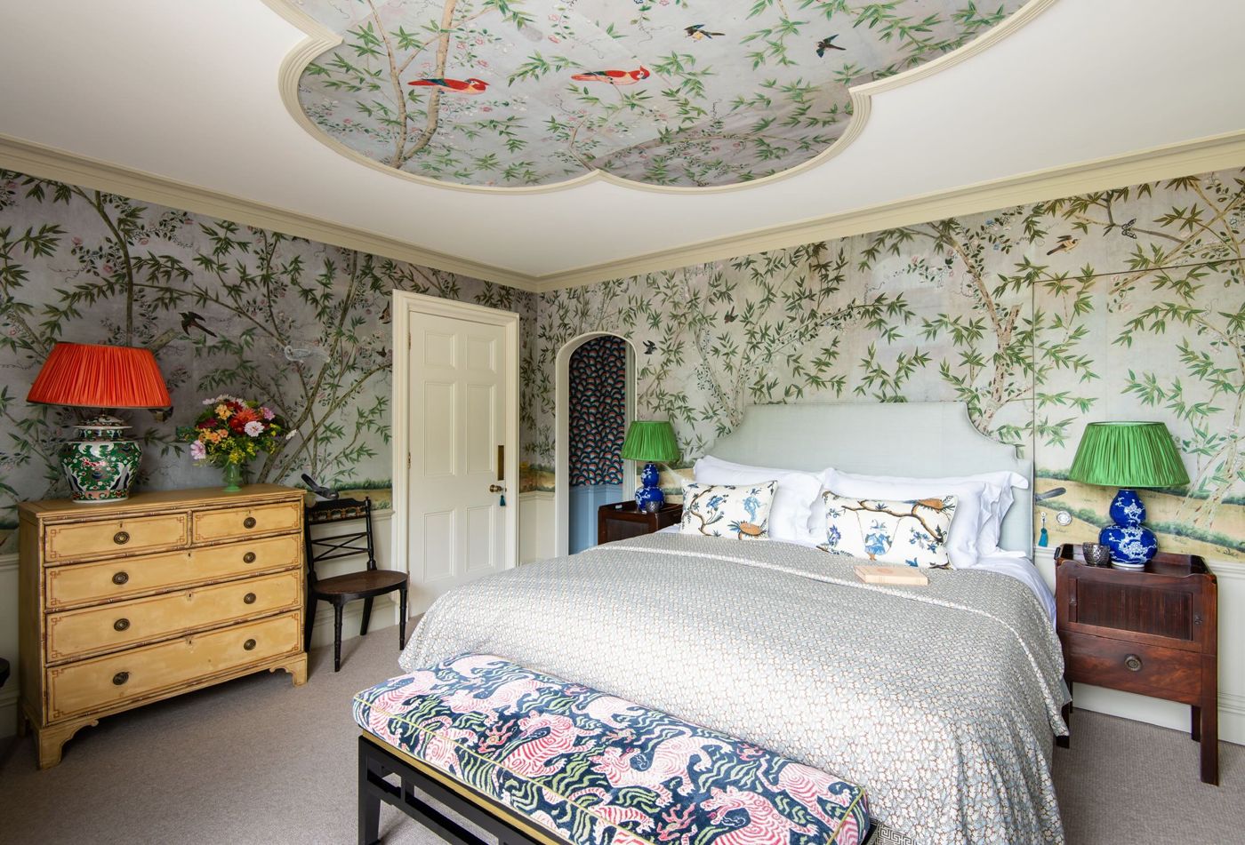 A bedroom hung with hand-painted Chinese wallpaper